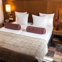Een bed of bedden in een kamer bij Hotel Amstelzicht