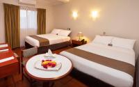 Cama o camas de una habitación en DM Hoteles Nasca