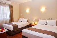 Cama o camas de una habitación en DM Hoteles Nasca