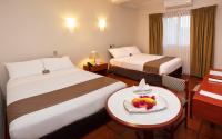 Cama o camas de una habitación en DM Hoteles Nasca