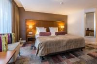 Een bed of bedden in een kamer bij Hotel Amstelzicht