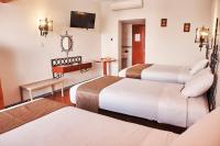 Cama o camas de una habitación en DM Hoteles Nasca