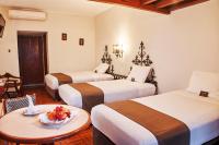 Cama o camas de una habitación en DM Hoteles Nasca