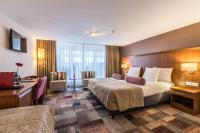 Een bed of bedden in een kamer bij Hotel Amstelzicht