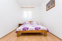 Posteľ alebo postele v izbe v ubytovaní Apartman Justinić