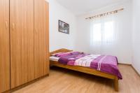 Posteľ alebo postele v izbe v ubytovaní Apartman Justinić