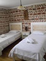 Postel nebo postele na pokoji v ubytování Gizemli Konak