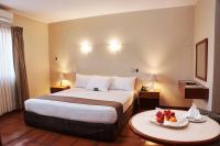 Cama o camas de una habitación en DM Hoteles Nasca