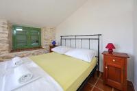 Postel nebo postele na pokoji v ubytování Villa Kamena