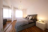 Posteľ alebo postele v izbe v ubytovaní Carmen Apartment Deluxe