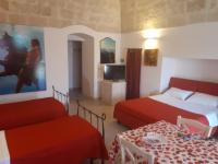 A bed or beds in a room at B&B Carpignano affittacamere