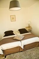 a bedroom with two beds and a lamp at Villa des Groseilliers Spa Practice golf moutons in Loison-sur-Créquoise