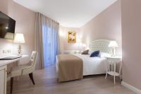 A bed or beds in a room at Grand Hotel Salsomaggiore