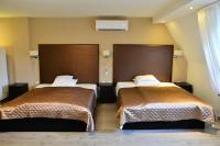 A bed or beds in a room at Room4U Apartment