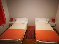 Cama ou camas em um quarto em Apartman Buky
