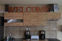 A kitchen or kitchenette at Room4U Apartment