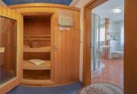 a bathroom with a shower and a toilet in a room at Hotel Plankl in Altötting