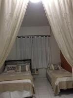Charmoso apartamento Copacabanaにあるベッド