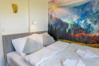Posteľ alebo postele v izbe v ubytovaní Apartament Logana z Sauną - 5D Apartamenty