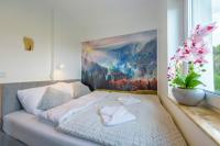 Posteľ alebo postele v izbe v ubytovaní Apartament Logana z Sauną - 5D Apartamenty