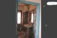 A bathroom at On The Beach La Rena Beddha