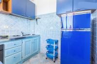 A kitchen or kitchenette at On The Beach La Rena Beddha