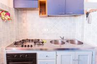 A kitchen or kitchenette at On The Beach La Rena Beddha