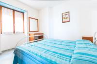 A bed or beds in a room at On The Beach La Rena Beddha