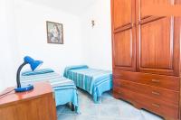 A bed or beds in a room at On The Beach La Rena Beddha