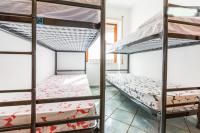 A bed or beds in a room at On The Beach La Rena Beddha
