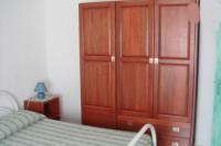A bed or beds in a room at On The Beach La Rena Beddha