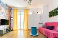 Televízia a/alebo spoločenská miestnosť v ubytovaní Apartamentos Momas La Casa De Mamá