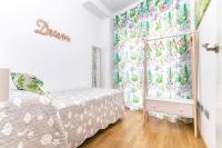 Posteľ alebo postele v izbe v ubytovaní Apartamentos Momas La Casa De Mamá