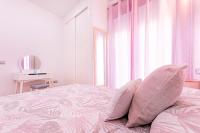 Posteľ alebo postele v izbe v ubytovaní Apartamentos Momas La Casa De Mamá