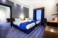 Holiday Bahrain Hotelにあるベッド