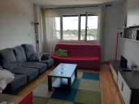A seating area at Precioso apartamento