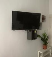 Televízia a/alebo spoločenská miestnosť v ubytovaní City Corso Apartman