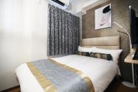 SHINJUKU GLOBAL HOTELにあるベッド