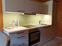 a kitchen with a sink and a counter top at Haus Silke in Silbertal