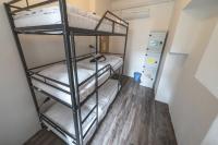 Łóżko lub łóżka w pokoju w obiekcie Hostel Orange