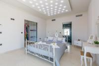 Posteľ alebo postele v izbe v ubytovaní Villa Kounoupidiana