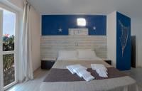 a bedroom with a bed with two towels on it at Albergo Serena in Lerici