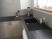a kitchen with a sink and a counter top at Maison de ville 3 chambres 3 salles d&#39;eau parking 2 places in Romorantin