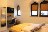Postel nebo postele na pokoji v ubytování City Hotel Bamberg
