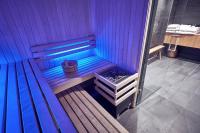 a sauna with a wooden bench in a room at Maison Nô - Hôtel et Rooftop in Lyon