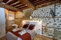 Cama o camas de una habitación en Lofts amantes de Toledo -LOFT COBERTIZO