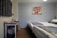 SHINJUKU GLOBAL HOTELにあるベッド