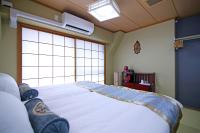 SHINJUKU GLOBAL HOTELにあるベッド