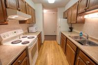 a kitchen with a white stove and a sink at Wedgewood Resort in Fairbanks