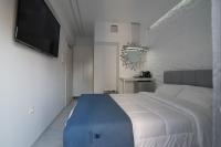 Posteľ alebo postele v izbe v ubytovaní Petite Palace Aristotelous 3